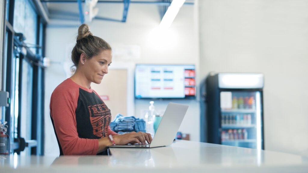 Fitness business owner saving time with Wodify software